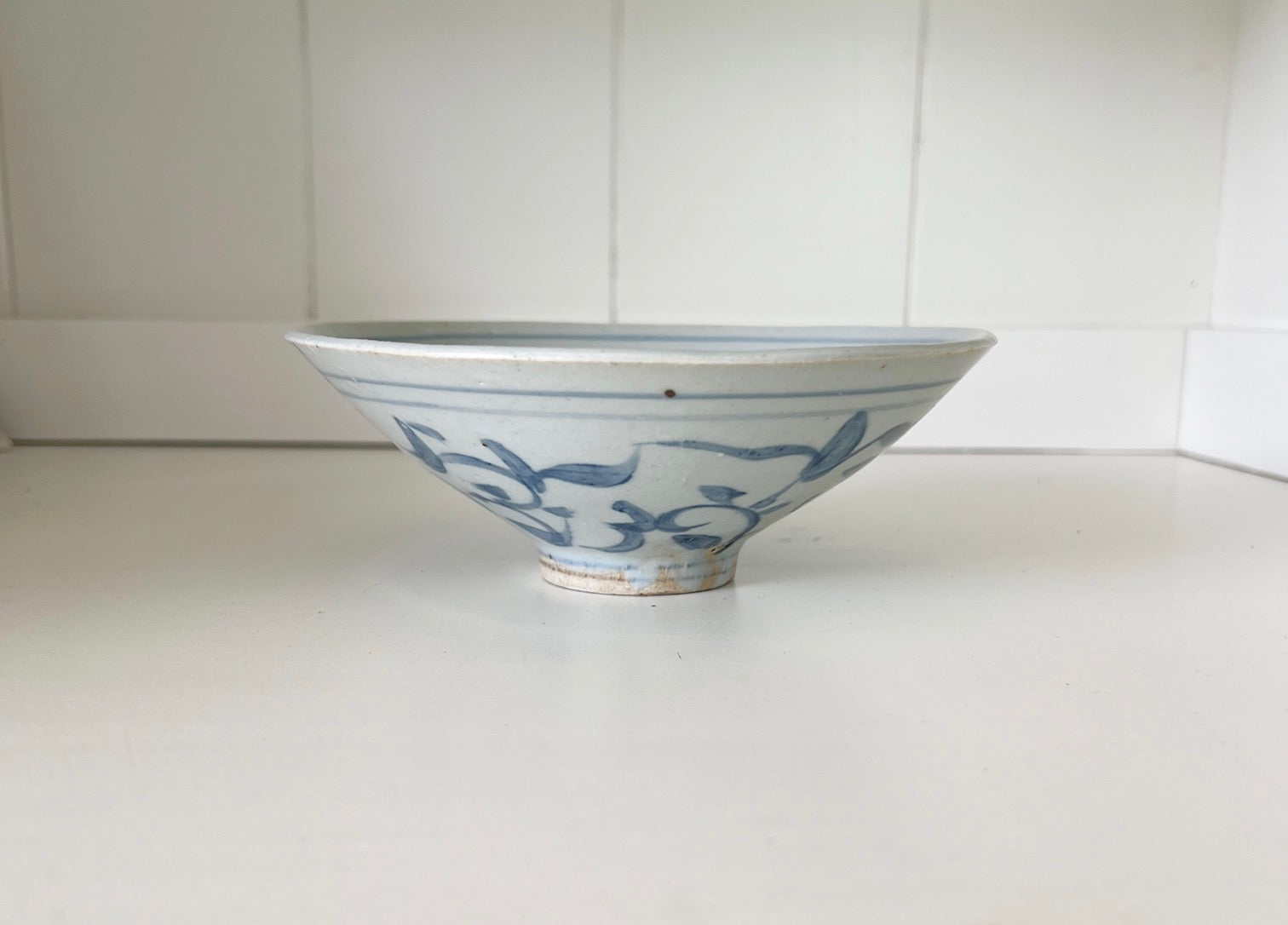 Side view of small floral ceramic bowl