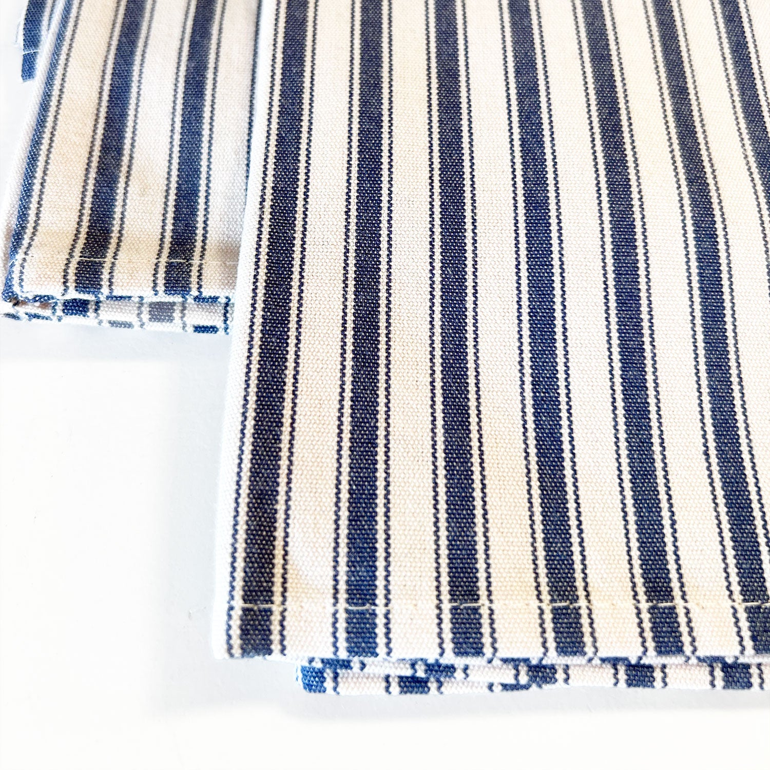 Close up of navy cream mattress ticking napkins for everyday use